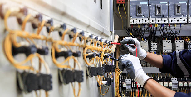 Professional Electrical Panel Upgrade technician working in Muscatine County County, IA